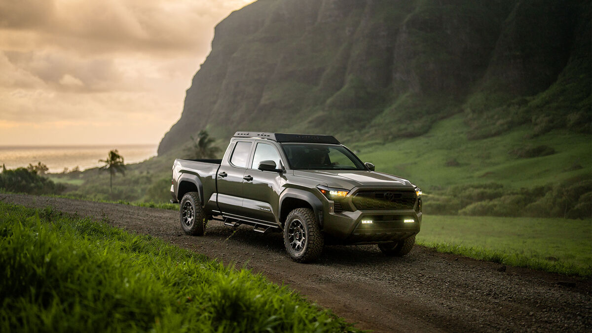 2024 Toyota Tacoma traveling through a green valley